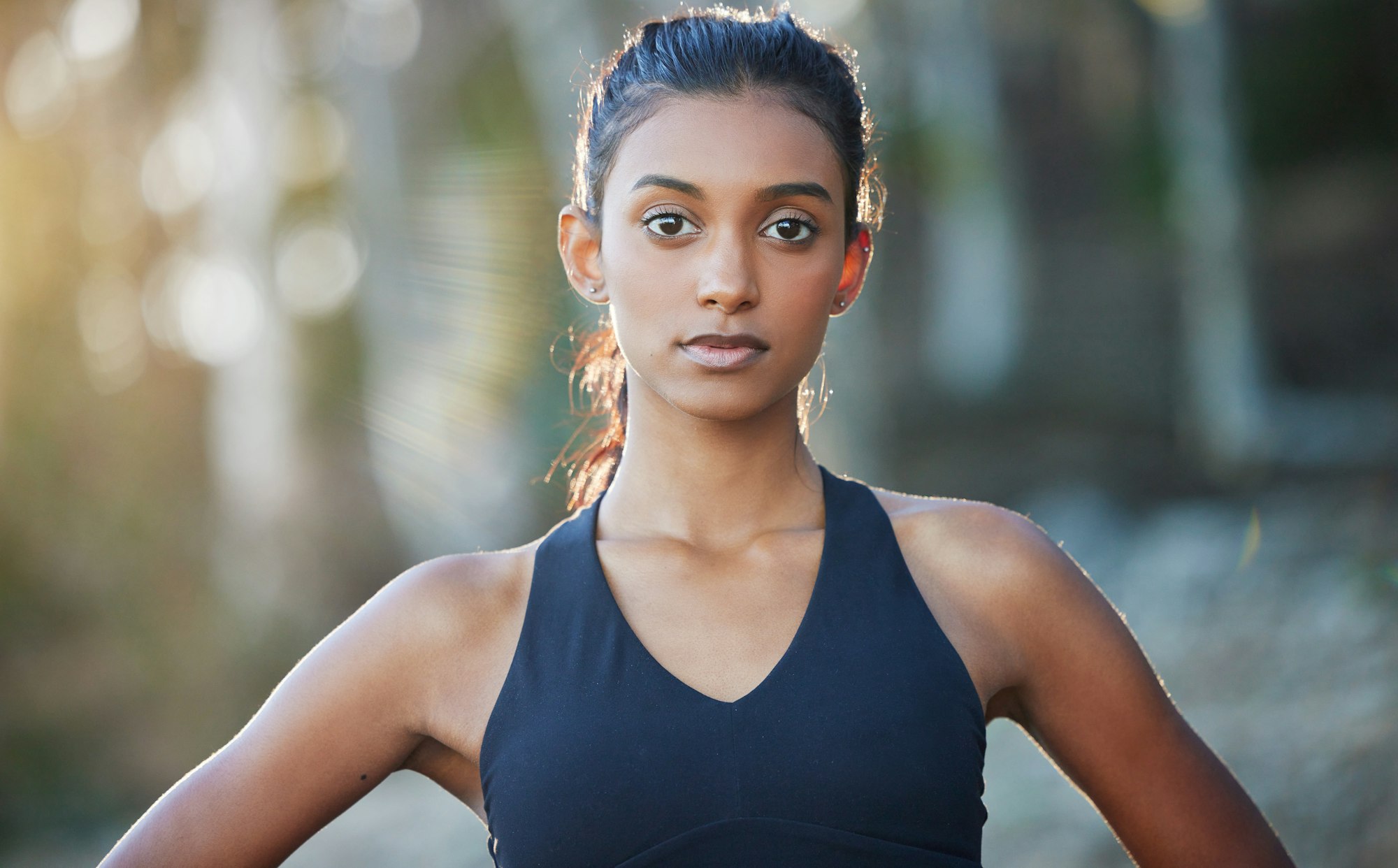 Tomorrow you will wish you had started today. Portrait of a sporty young woman exercising outdoors.