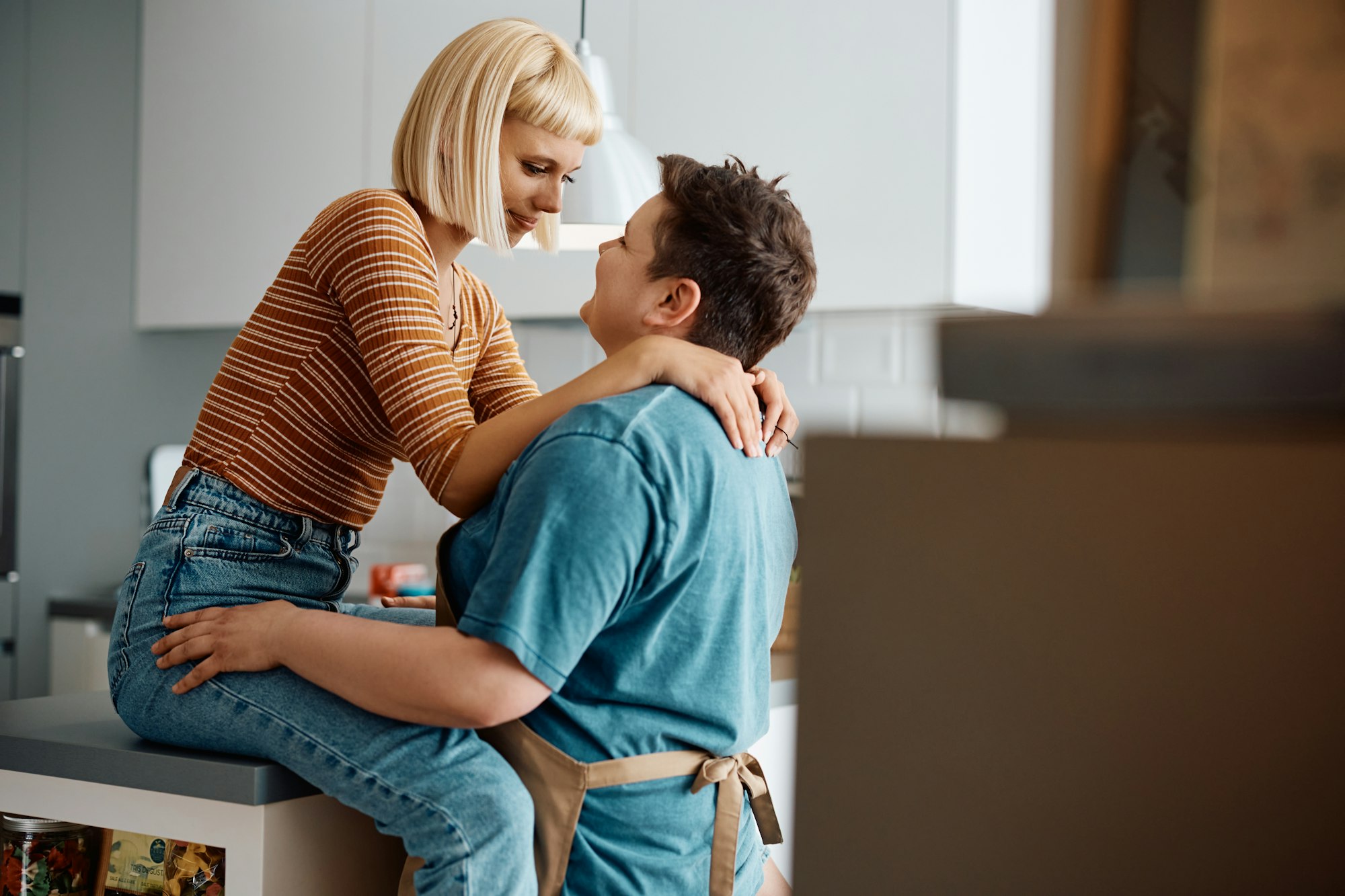 Young lesbian women enjoying in their love at home.