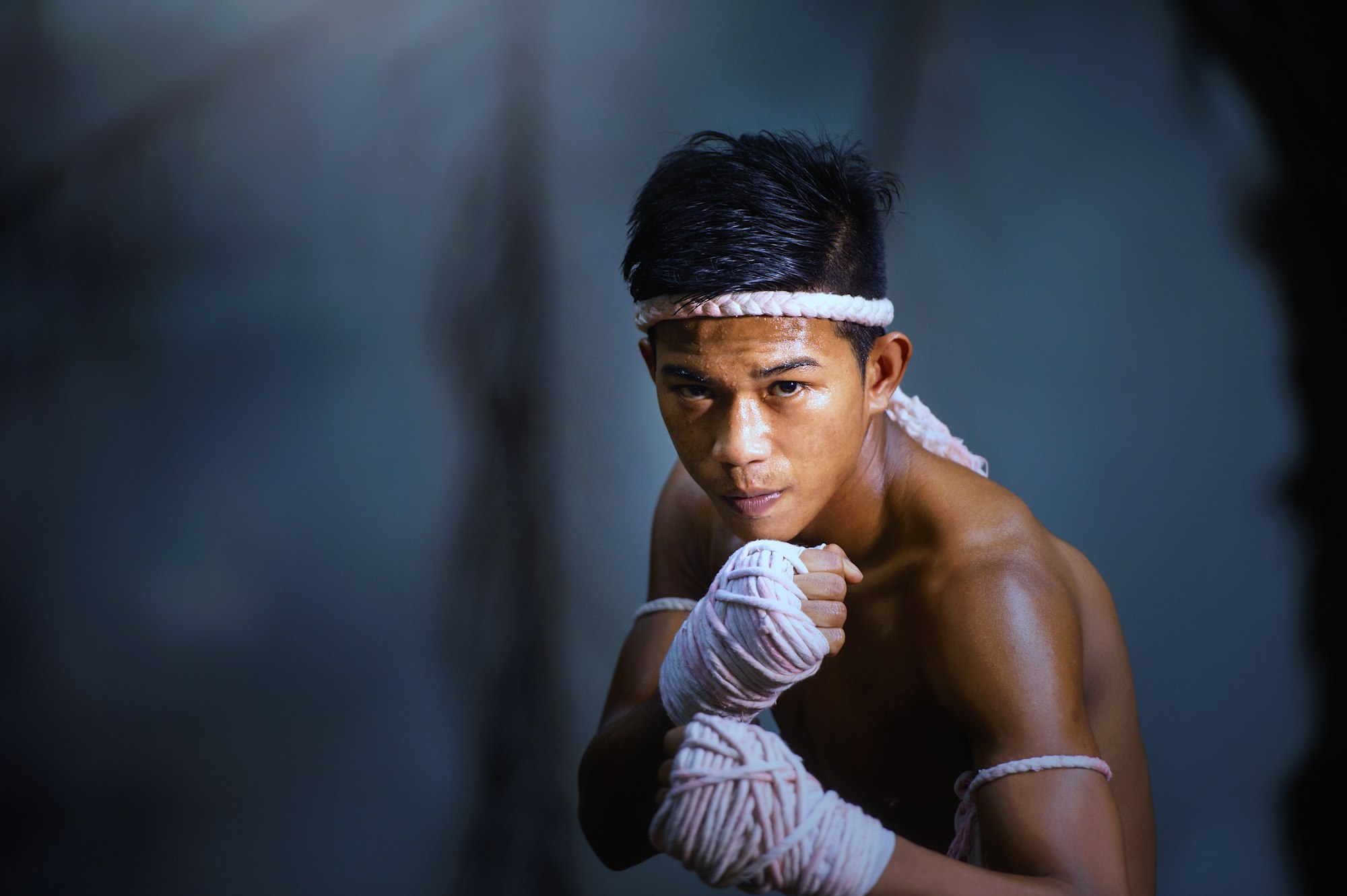 Topless man in fighting position